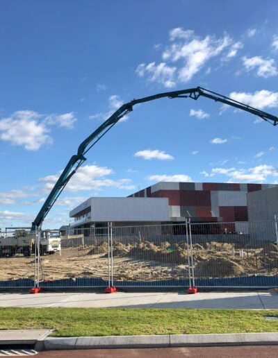 Group One Construction signage in front of a crane