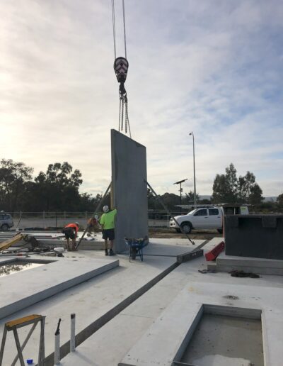 Team of tradespersons install a tilt up panel