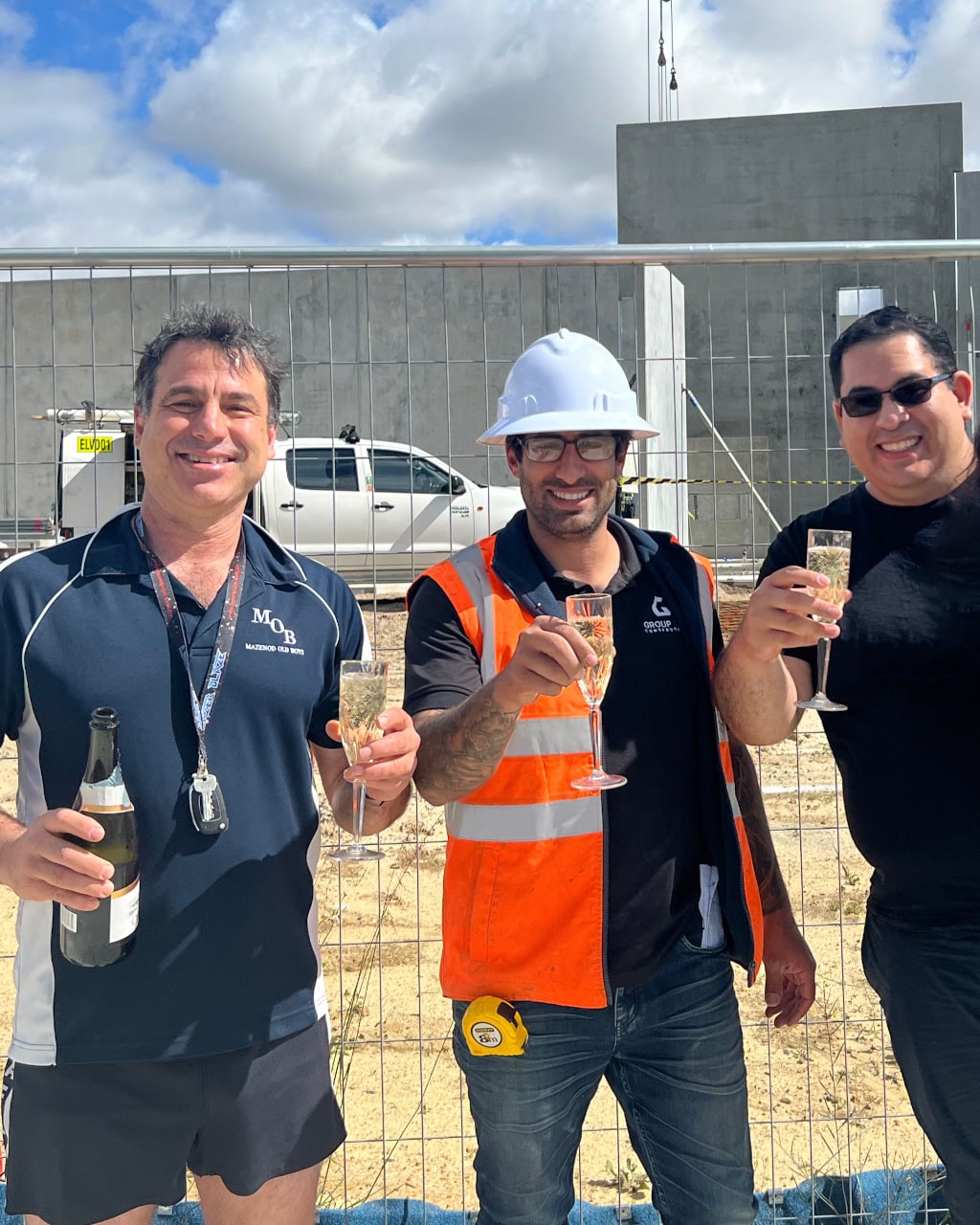 Group One Construction team celebrates a completed project